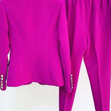 Purple suit jacket and pants on a white background