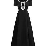 Vintage black dress with jeweled bow details