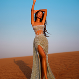 Woman posing in a slit corset gown in the desert