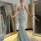 Silver crystal gown displayed on mannequin