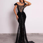 Model in sequin corset gown with cap sleeves