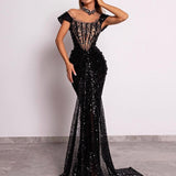 Model in sequin corset gown with cap sleeves