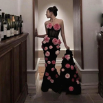 Strapless gown with cascading pink rose petals