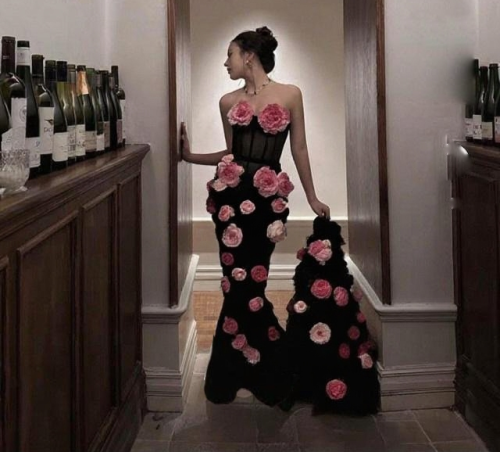 Strapless gown with cascading pink rose petals